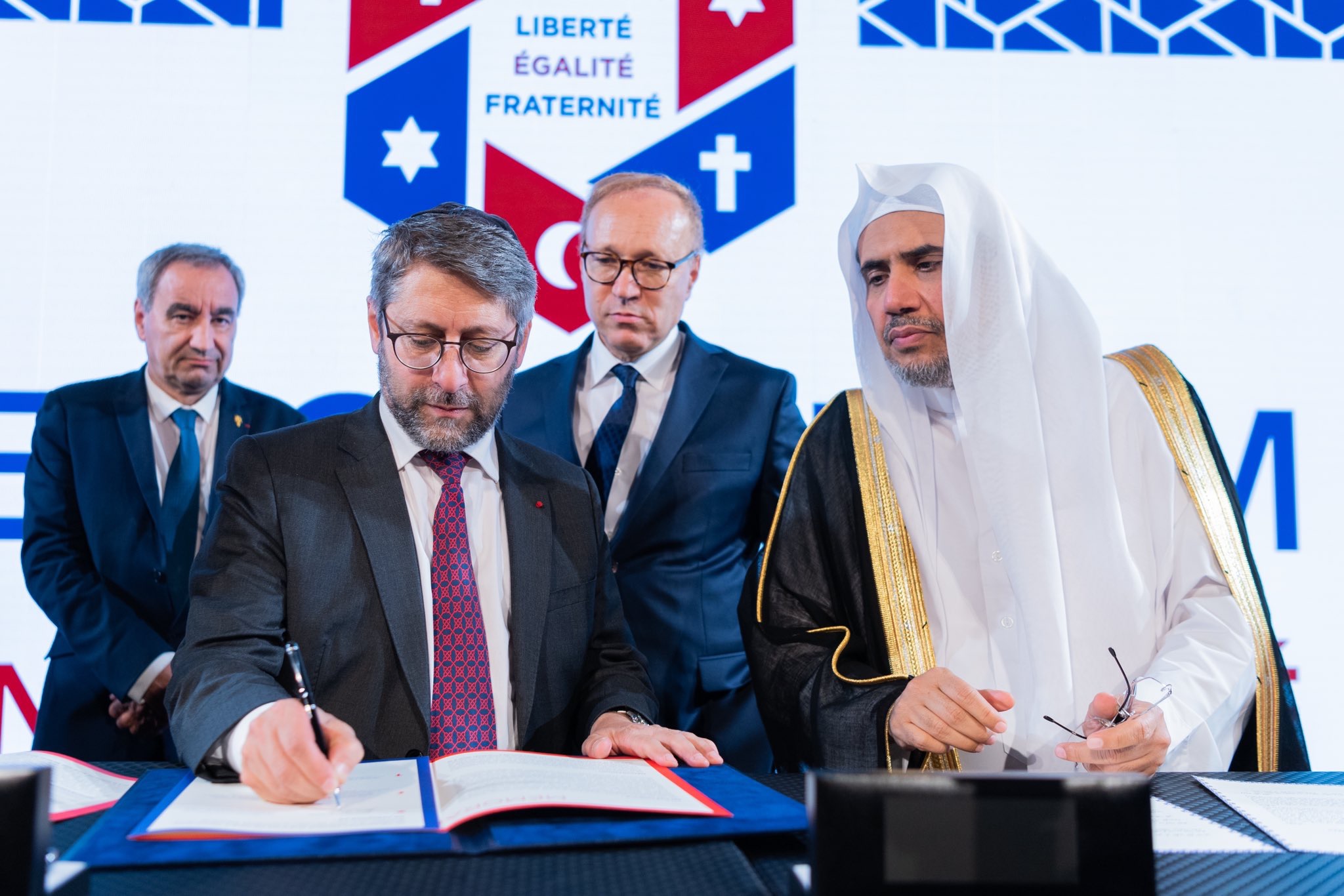 HE Dr. Mohammad Alissa stood with prominent Muslim, Jewish and Christian leaders to sign a historic MOU, pledging to continue meaningful interfaith dialogue