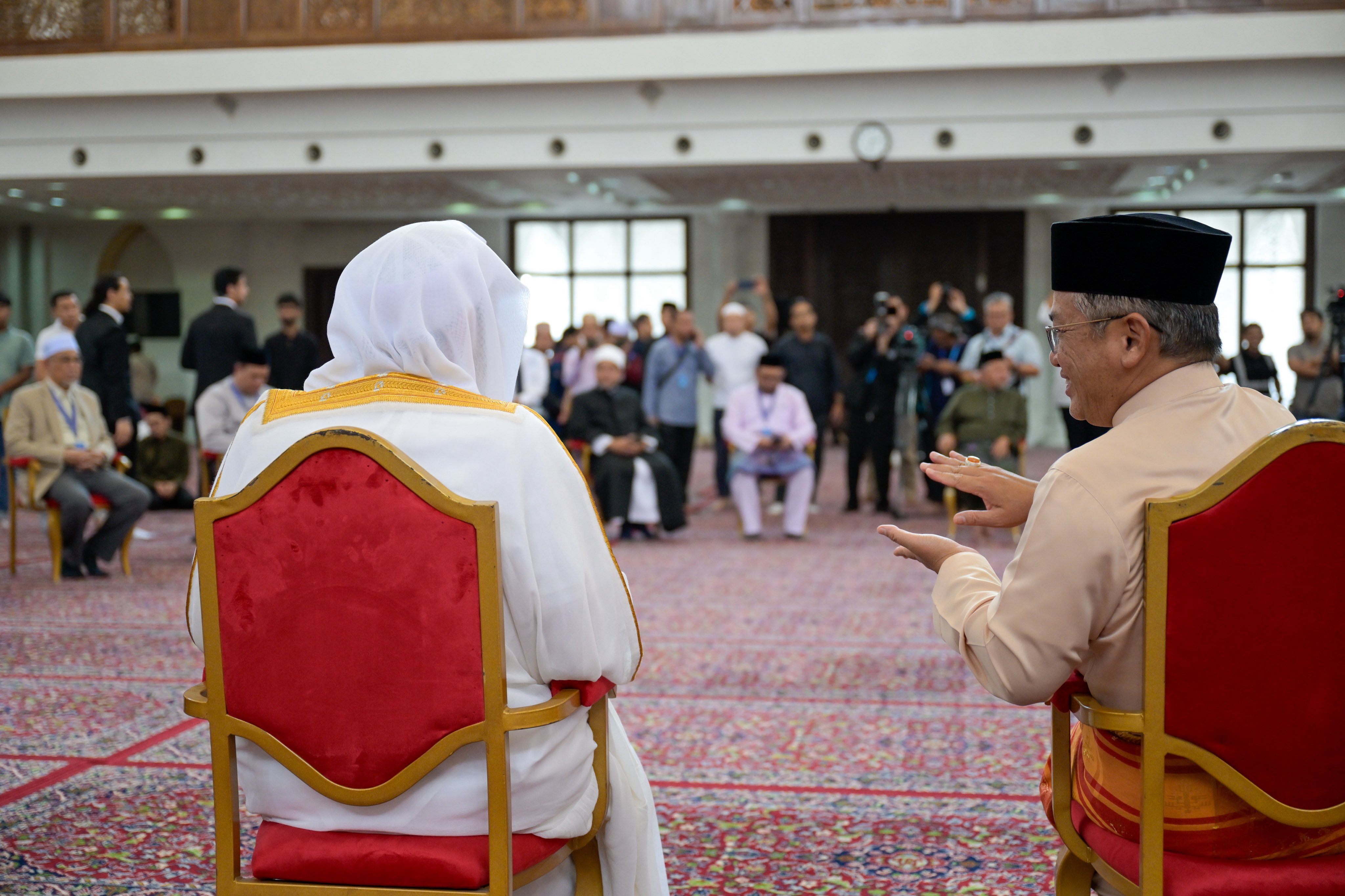 After delivering the Friday sermon and leading the prayer at the largest mosque in the Malaysian capital, Kuala Lumpur: